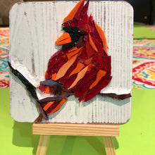 Load image into Gallery viewer, Red mosaic glass cardinal sitting on a snow covered branch shown with easel